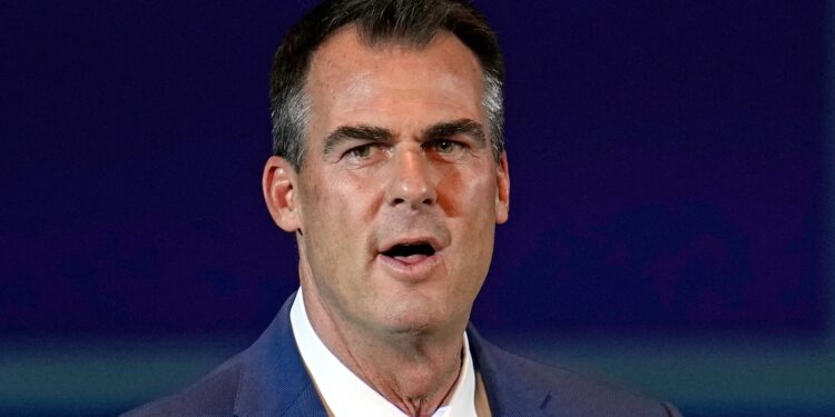 From business suits to the governor’s desk his wealth paved the way (Photo: Kevin Stitt/Flickr)